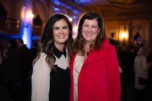 Guests gather and celebrate at the Central City Association’s holiday party, socializing in a festive indoor setting with warm lighting and seasonal décor.